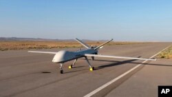 This image released by the official website of Iran's Defense Ministry on Aug. 22, 2023, shows the Mohajer-10 drone at an undisclosed location in Iran.