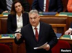 Hungarian Prime Minister Viktor Orban addresses the parliament in Budapest, Hungary, Dec. 13, 2023.