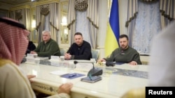FILE - Ukraine's President Volodymyr Zelenskyy, right, attends a meeting with Foreign Minister of the Kingdom of Saudi Arabia Prince Faisal bin Farhan al-Saud in Kyiv, Feb. 26, 2023. (Ukrainian Presidential Press Service/Handout via Reuters)