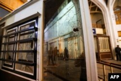 Bullet holes riddle windows at the site of a shooting attack at Iran's Shah Cheragh mausoleum in the Fars province capital Shiraz, on Aug. 13, 2023.