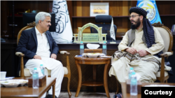 Pakistan’s Secretary Interior Muhammad Khurram Agha, left, talks with Taliban Deputy Minister for Interior Muhammad Nabi Omari, in Afghanistan, May 30, 2024. (Photo courtesy of Afghan Interior Ministry)