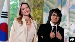 Angelina Jolie and son Maddox Jolie-Pitt arrive for the State Dinner with President Joe Biden and the South Korea's President Yoon Suk Yeol at the White House, April 26, 2023, in Washington.