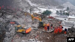  ناحیۀ زینژیانگ ولایت یونن، جاییکه لغزش زمین جان ۳۱ نفر را گرفته و شمار نامعلوم دیگر ناپدید شده اند