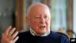 Holocaust survivor Herbert Rubinstein talks during an interview with The Associated Press at his home in Duesseldorf, Germany, April 25, 2024. 