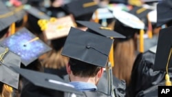 FILE - Graduates at the University of Toledo commencement ceremony in Toledo, Ohio, May 5, 2018. 