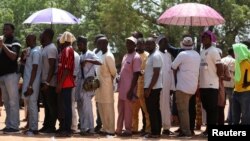 Voters wait to cast ballots at Karewa Primary School during Nigeria's presidential election in Yola, Nigeria, Feb. 25, 2023.