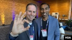 Alex Luebke, Vivek Kumbhari and the PillBot are pictured at the TED Conference in Vancouver, British Columbia, which was held April 15-19, 2024. (Craig McCulloch/VOA)