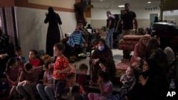 Palestinians take shelter in the Nasser hospital during Israeli bombardment in Khan Younis, Gaza Strip, Oct. 27, 2023.