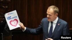 Newly appointed Polish Prime Minister Donald Tusk presents his government's programme and asks for a vote of confidence in Parliament in Warsaw, Dec. 12, 2023. 
