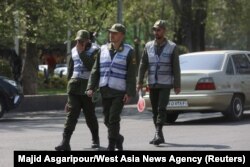 FILE - Members Iran's police force walk on a street amid the implementation of the new hijab surveillance in Tehran, Iran, April 15, 2023. (Majid Asgaripour/WANA via Reuters)