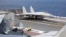 FILE - In this photo released by Xinhua News Agency, a J-15 Chinese fighter jet prepares to take off from an aircraft carrier during military exercises around the Taiwan Island by the Chinese People's Liberation Army, April 9, 2023. 