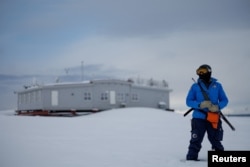 CNR (Italian National Research Council) station leader Ombretta Dell’Aqua, 43, stands lookout for polar birds in Ny-Aalesund, April 5, 2023.