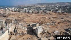 Foto udara menunjukkan pemandangan kerusakan akibat banjir dahsyat di kota Derna, Libya timur, pada Sabtu 16 September 2023.