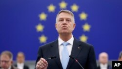 FILE - Romania President Klaus Iohannis addresses the European Parliament, Feb. 7, 2024 in Strasbourg, eastern France.