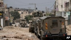 Izraelska vojna vozila tokom racije u izbjegličkom kampu Jenin na Zapadnoj obali, 21. maja 2024.