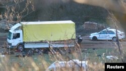 The bodies of migrants are seen next to a truck near Sofia, Bulgaria, Feb. 17, 2023.
