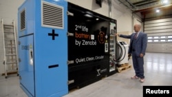 Zenobe's Founder Director Steven Meersman shows off one of the company's second-life battery energy storage units at the startup's innovation centre in Portsmouth, Britain February 20, 2023. (REUTERS/Nick Carey)