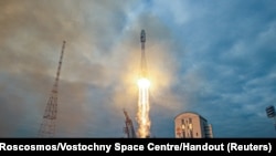 FILE — A Soyuz-2.1b rocket booster with a Fregat upper stage and the lunar landing spacecraft Luna-25 blasts off from a launchpad at the Vostochny Cosmodrome in the far eastern Amur region, Russia, Aug. 11, 2023. 