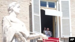 Pope Francis delivers a blessing during the Angelus noon prayer in St. Peter's Square at the Vatican, Aug. 13, 2023.