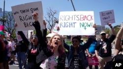 FILE - Supporters cheer up as Vice President Harris gives remarks at the Women's March in Los Angeles, Apr. 15, 2023. One year ago, the US Supreme Court rescinded a five-decade-old right to abortion. 