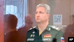 FILE - This photo taken and released by Basmanny District Court press service on April 24, 2024, shows Deputy Defense Minister Timur Ivanov standing in a defendants' cage in court in Moscow.