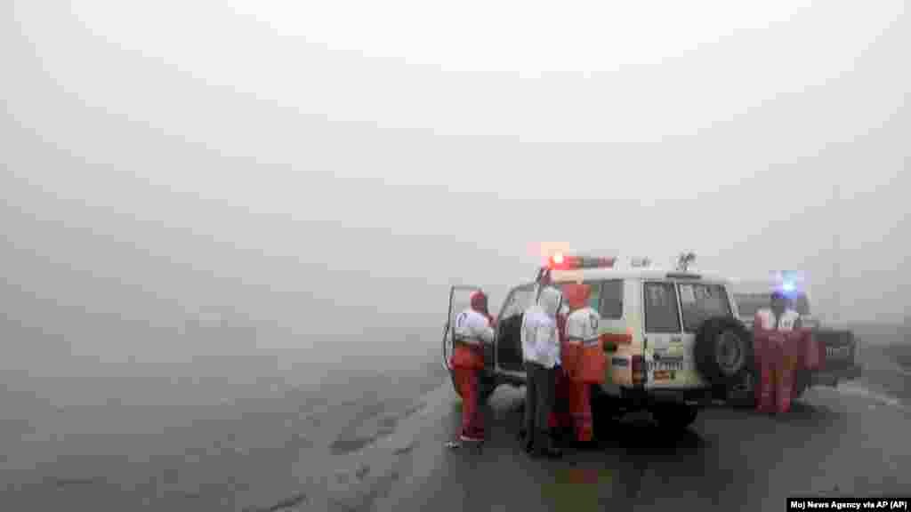 In this photo provided by Moj News Agency, rescue teams are seen near the site of the incident of the helicopter carrying Iranian President Ebrahim Raisi in Varzaghan in northwestern Iran, May 19, 2024.