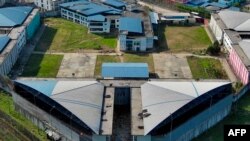 Aerial view showing the marks left by mattresses and other objects set on fire on a roof of the Guayas 4 block, in the Regional 8 prison complex in Guayaquil, Ecuador, taken on March 28, 2024, a day after an 'internal revolt.'