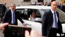 Pope Francis waves from his car as he arrives at The Vatican, April 1, 2023 after receiving treatment at the Agostino Gemelli University Hospital for bronchitis.