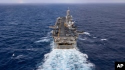 In this handout photo from the U.S. Navy, the amphibious assault ship USS Bataan travels through the Atlantic Ocean on July 20, 2023. 