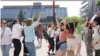 Iranians dance in Toronto, Canada, on May 20, 2024, to celebrate the death a day earlier of Iranian President Ebrahim Raisi, who was reviled by opponents of Iran's authoritarian Islamist rulers. (Behrang Rahbari/VOA Persian)