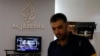 FILE - An employee of Qatar-based news channel Al Jazeera is seen at the media outlet's offices in Jerusalem, July 31, 2017.