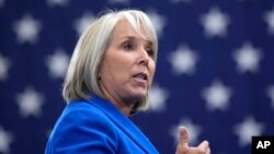 FILE - New Mexico Gov. Michelle Lujan Grisham speaks at the Arcosa Wind Towers, Aug. 9, 2023, in Belen, NM. 
