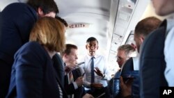 British Prime Minister Rishi Sunak talks to journalists on his plane as he travels from Northern Ireland to Birmingham during a day of campaigning for this year's General Election due to be held on July 4, on May 24, 2024. 