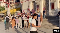 A man passes a small opposition protest in Tunis. (Lisa Bryant/VOA)