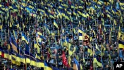 Ukrainian flags flutter over hundreds graves of Ukrainian servicemen killed in fighting since Russian invasion, in Kharkiv, Ukraine, June 6, 2024.