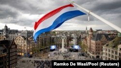 People gather as the Netherlands holds its annual World War II remembrance ceremony in Amsterdam, Netherlands, May 4, 2024. (Remko De Waal/Pool via Reuters)