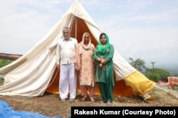Mani Ram, a resident of Bachhwai village in India's Himachal Pradesh state, whose home collapsed after intense rains now lives in a temporary shelter.