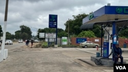 A gas station displays fuel prices in U.S. dollars, in Harare, April 5, 2024. The Zimbabwean government says, for now, commodities like fuel will still be bought and sold using the U.S. currency. (Columbus Mavhunga/VOA)