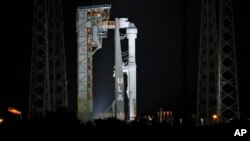 Boeing's Starliner capsule atop an Atlas V rocket is seen at the Cape Canaveral Space Force Station, late Monday, May 6, 2024, in Cape Canaveral, Fla. (AP Photo/Terry Renna)