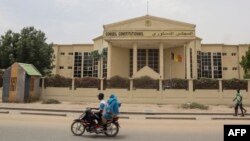 A motorcyclist drives past the Constitutional Council building in N'Djamena on March 14, 2024. Chad's Constitutional Council says it is examining the files of about 20 candidates in the race for the central African state's May 6 presidential polls. 