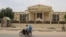 A motorcyclist drives past the Constitutional Council building in N'Djamena on March 14, 2024. Chad's Constitutional Council says it is examining the files of about 20 candidates in the race for the central African state's May 6 presidential polls. 