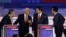 Former New Jersey Gov. Chris Christie, former Vice President Mike Pence, Florida Gov. Ron DeSantis and businessman Vivek Ramaswamy talk during break in a Republican presidential primary debate, Aug. 23, 2023, in Milwaukee.