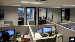 FILE -- Traditional offices and cubicles in in Melville, New York.