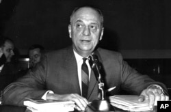 FILE - In this April 9, 1965 file photo, Surgeon General Luther Terry testifies on Capitol Hill in Washington before the House Commerce Committee hearing on proposed labeling of cigarette packages.