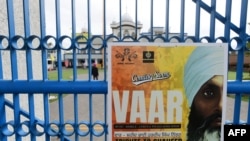 FILE - A poster advertising a tribute for Hardeep Singh Nijjar is displayed at a temple in Surrey, British Columbia, Canada, on Sept. 19, 2023. India and Canada expelled six of each other's diplomats Oct. 14, 2024, in a dispute related to Nijjar's death. 