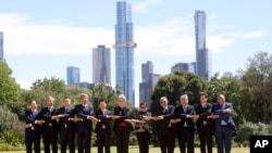 ASEAN Foreign Ministers react during a family photo at Government House during the Association of Southeast Asian Nations, ASEAN-Australia Special Summit in Melbourne, Australia, March 6, 2024. 