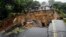 FILE - A road connecting the cities of Blantyre and Lilongwe is seen damaged following heavy rains caused by Tropical Cyclone Freddy in Blantyre, Malawi, March 14, 2023.