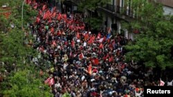 People gather outside Spain's Socialist Party headquarters to show support for the Secretary General of PSOE and Prime Minister Pedro Sanchez, in Madrid, Spain, April 27, 2024.