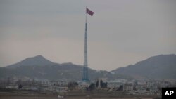 FILE - A North Korean flag flutters in North Korea's village Gijungdong as seen from an South Korea's observation post inside the demilitarized zone in Paju, South Korea, during a media tour, March 3, 2023.