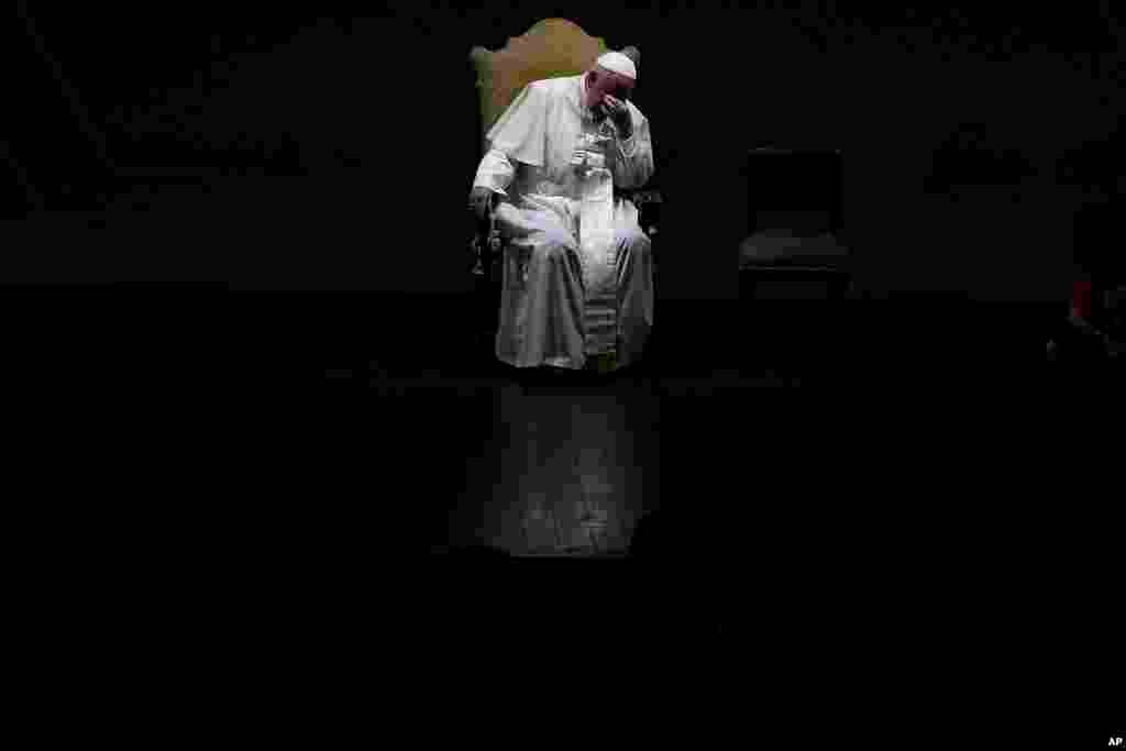 Pope Francis gestures as he attends an annual gathering of pro-family organizations at the Auditorium della Conciliazione, in Rome.